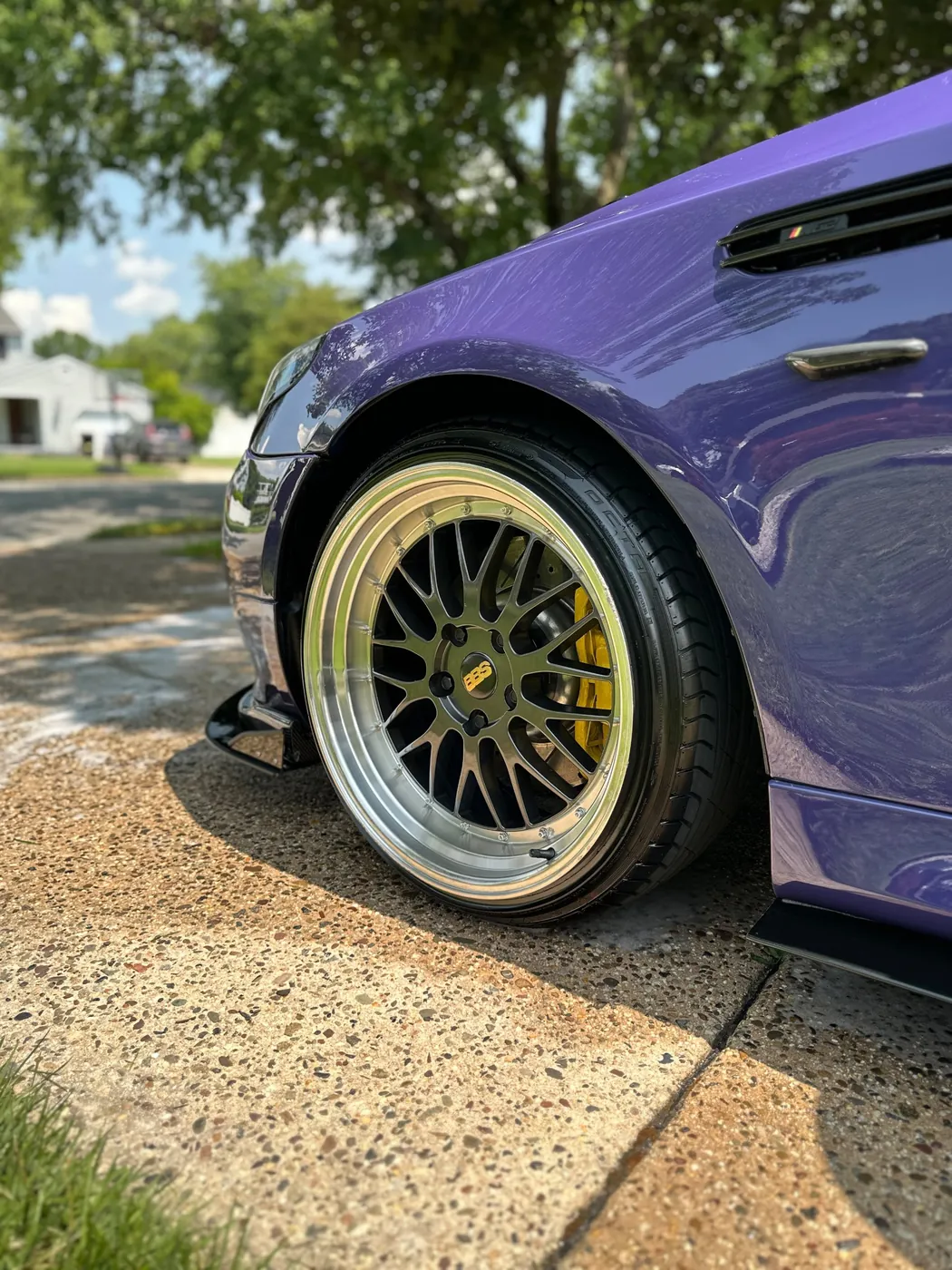 Glossy purple BMW M5 and BBS wheel after a detail